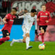 FILE - Bayern's Jamal Musiala, center, and Leverkusen's Piero Hincapie, left, challenge for the ball during the German Bundesliga soccer match between Bayer Leverkusen and Bayern Munich in Leverkusen, Germany, Sunday, March 19, 2023. Bayern Munich hosts Bayer Leverkusen when the Bundesliga returns from the international break with its biggest game of the season so far. Something will need to give on Friday between the only two teams remaining with perfect records. Leverkusen has racked up 11 goals in three wins from three games and leads on goal difference from Bayern. (AP Photo/Martin Meissner, File)