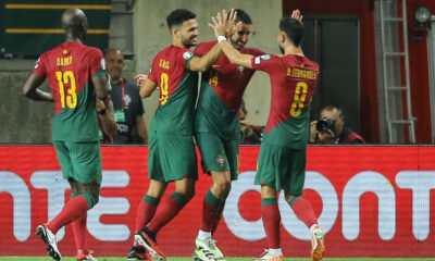Portugal's Goncalo Inacio, 2nd right, celebrates with Bruno Fernandes, right, and Goncalo Ramos after scoring his side's fourth goal during the Euro 2024 group J qualifying soccer match between Portugal and Luxembourg at the Algarve stadium outside Faro, Portugal, Monday, Sept. 11, 2023. (AP Photo/Joao Matos)