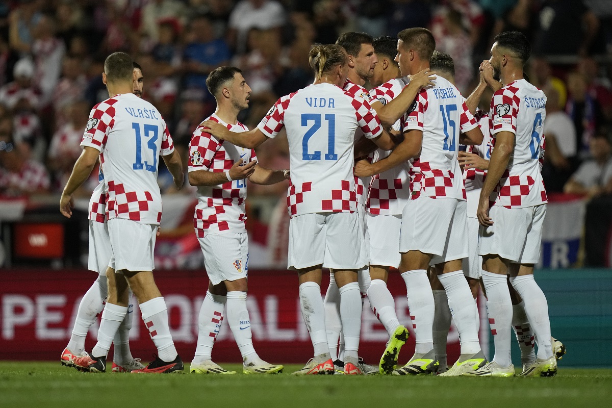 Croatia players celebrate after Croatia's Andrej Kramaric scored his side's fourth goal during the Euro 2024 group D qualifying soccer match between Croatia and Latvia at Rujevica stadium in Rijeka, Croatia, Friday, Sept. 8, 2023.