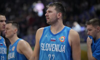 Slovenia guard Luka Doncic (77) celebrates after winning against Italy during the Basketball World Cup classification match in Manila, Philippines, Saturday, Sept. 9, 2023.