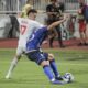 Kosovo's Mergim Vojvoda, right, fights for the ball with Switzerland's Ruben Vargas during the Euro 2024 group I qualifying soccer match between Kosovo and Switzerland at the Fadil Vokrri stadium in Pristina, Kosovo, Saturday, Sept. 9, 2023. (AP Photo/Visar Kryeziu)