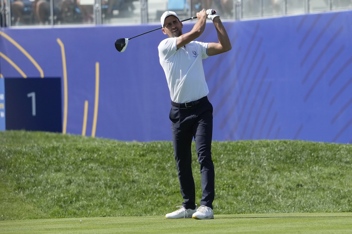 tennis player Novak Djokovic plays his tee shot on the 1st hole during an all stars golf match between Team Colin Montgomerie and Team Cory Pavin at the Marco Simone Golf Club in Guidonia Montecelio, Italy, Wednesday, Sept. 27, 2023. The Ryder Cup starts Sept. 29, at the Marco Simone Golf Club. (AP Photo/Andrew Medichini)