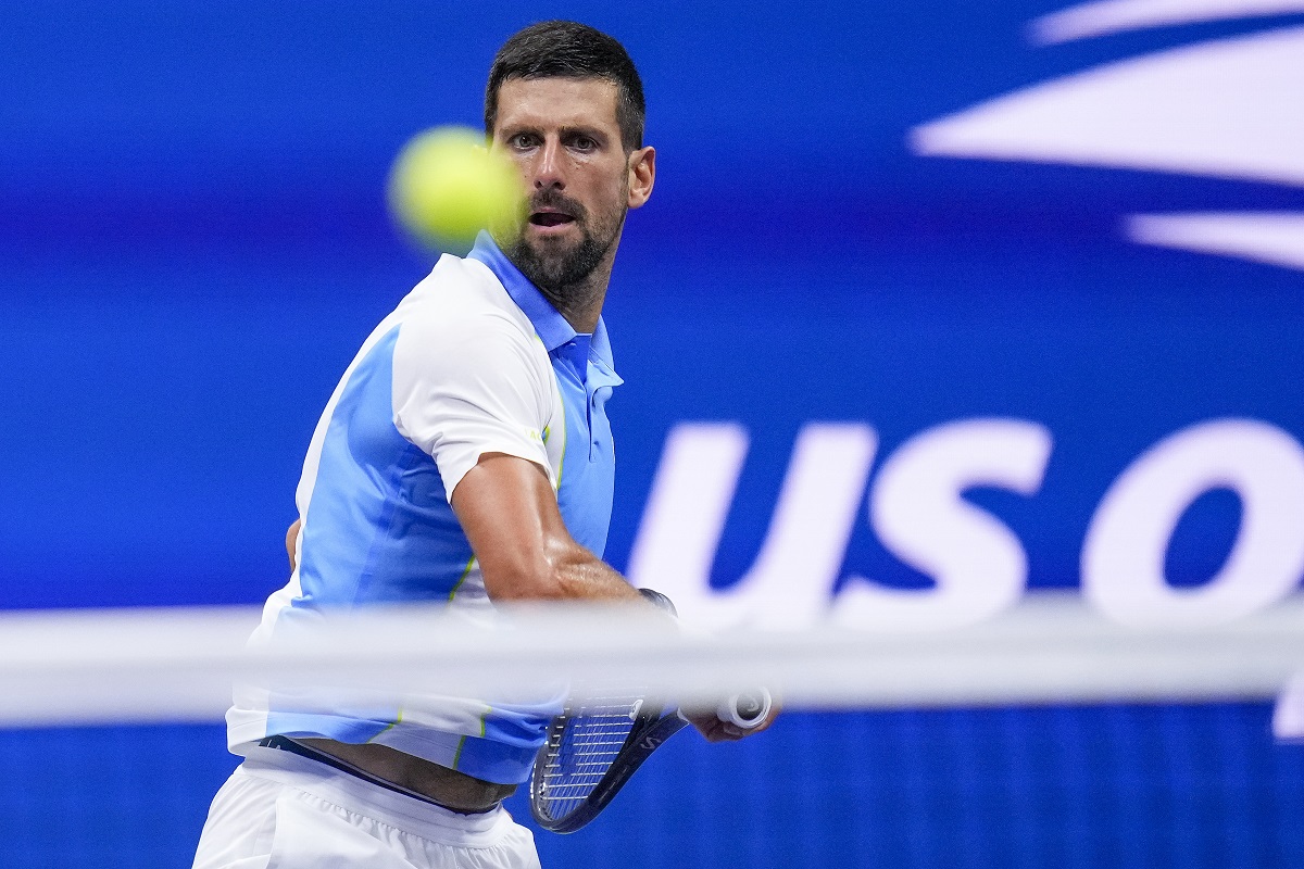 Novak Djokovic, of Serbia, returns a shot to Ben Shelton, of the United States, during the men's singles semifinals of the U.S. Open tennis championships, Friday, Sept. 8, 2023, in New York.