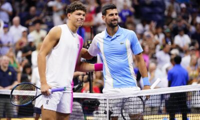 Ben Shelton, left, of the United States, and Novak Djokovic, of Serbia, pose for photographs ahead of their match during the men's singles semifinals of the U.S. Open tennis championships, Friday, Sept. 8, 2023, in New York.