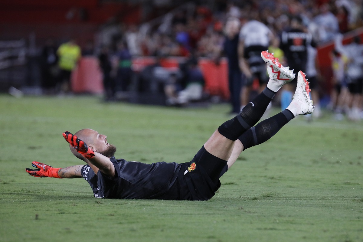Mallorca's goalkeeper Predrag Rajkovic celebrates after his teammate Abdon scored his side's second goal during a Spanish La Liga soccer match between Mallorca and Barcelona at the Son Moix stadium in Palma de Mallorca, Spain, Tuesday, Sept. 26, 2023. (AP Photo/Francisco Ubilla)