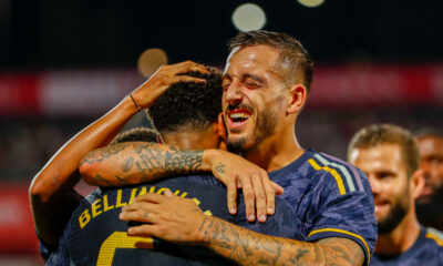 Real Madrid's Jude Bellingham celebrates with teammates after scoring his side's third goal during a Spanish La Liga soccer match between Girona and Real Madrid, at the Montilivi stadium in Girona, Spain, Saturday, Sept. 30, 2023. (AP Photo/Joan Monfort)