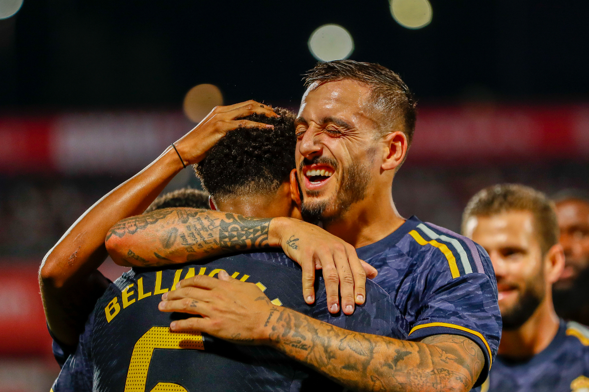 Real Madrid's Jude Bellingham celebrates with teammates after scoring his side's third goal during a Spanish La Liga soccer match between Girona and Real Madrid, at the Montilivi stadium in Girona, Spain, Saturday, Sept. 30, 2023. (AP Photo/Joan Monfort)