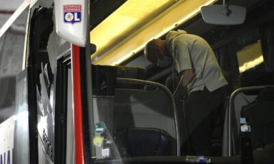 Police take finger prints in a bus that the Lyon soccer team were traveling in, before arriving at the Velodrome Stadium prior to the French League One soccer match between Olympique de Marseille and Lyon in Marseille, France, Sunday, Oct. 29, 2023. Lyon coach Fabio Grosso has suffered a head injury as the team bus came under attack from fans throwing projectiles before the French league soccer game against Marseille. (AP Photo/Daniel Cole)