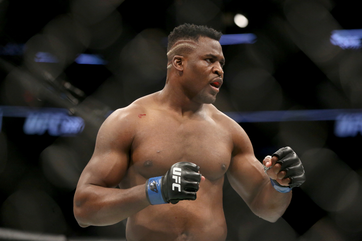 FILE - Francis Ngannou during a heavyweight championship mixed martial arts bout against Stipe Miocic at UFC 220, Sunday, Jan. 21, 2018, in Boston. Being the best heavyweight boxer in the world isn’t enough for Tyson Fury. He has appeared in WWE, been the subject of a Netflix reality series and is now in the Middle East to fight a former UFC star in the latest in a crossover bouts. Fighting Francis Ngannou on Saturday, Oct. 28, 2023 will earn Fury a reported $50 million. (AP Photo/Gregory Payan, File)