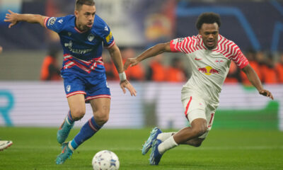 Real Sociedad's Kieran Tierney, right, is challenged by Red Star's Milan Rodic during the group G Champions League soccer match between RB Leipzig and Red Star Belgrade at the Red Bull arena stadium in Leipzig, Germany, Wednesday, Oct. 25, 2023. (AP Photo/Matthias Schrader)