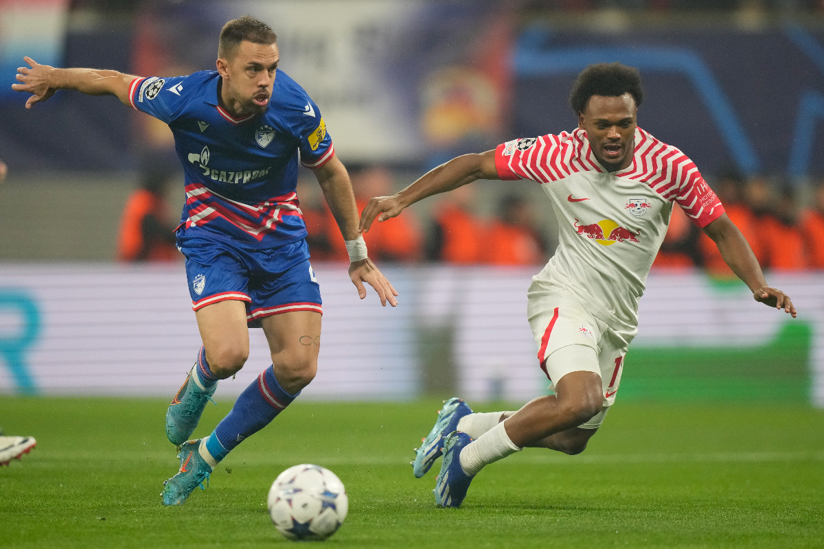 Real Sociedad's Kieran Tierney, right, is challenged by Red Star's Milan Rodic during the group G Champions League soccer match between RB Leipzig and Red Star Belgrade at the Red Bull arena stadium in Leipzig, Germany, Wednesday, Oct. 25, 2023. (AP Photo/Matthias Schrader)