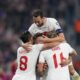 Turkey's Barıs Alper Yılmaz celebrates with teammates after scoring his side's opening goal during the Euro 2024 group D qualifying soccer match between Croatia and Turkey at the Opus Arena in Osijek, Croatia, Thursday, Oct. 12, 2023. (AP Photo/Darko Bandic)