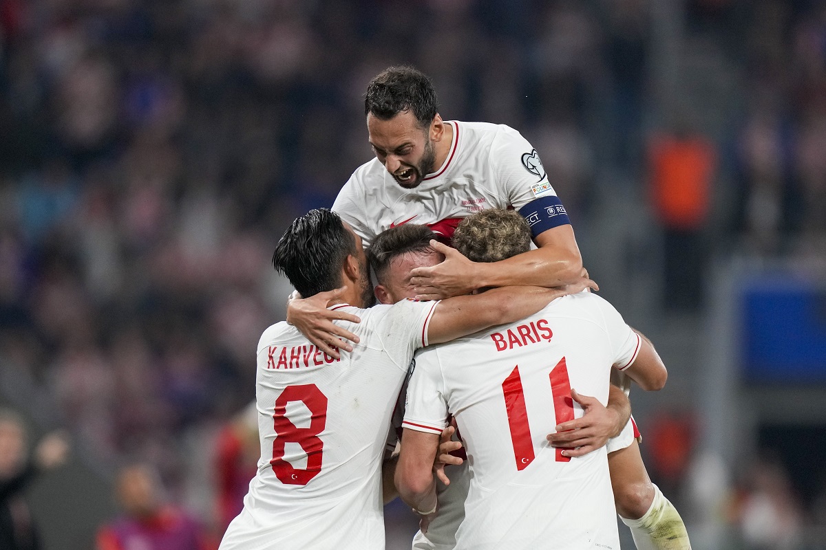 Turkey's Barıs Alper Yılmaz celebrates with teammates after scoring his side's opening goal during the Euro 2024 group D qualifying soccer match between Croatia and Turkey at the Opus Arena in Osijek, Croatia, Thursday, Oct. 12, 2023. (AP Photo/Darko Bandic)