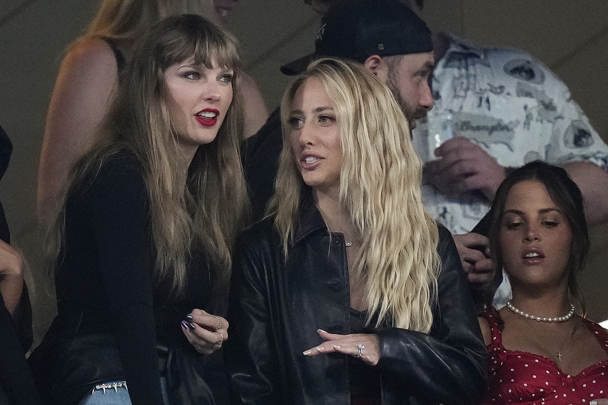 CORRECTS TO BRITTANY MAHOMES NOT BLAKE LIVELY - Taylor Swift, left, and Brittany Mahomes, center, watch play between the New York Jets and the Kansas City Chiefs during the second quarter of an NFL football game, Sunday, Oct. 1, 2023, in East Rutherford, N.J. (AP Photo/Frank Franklin II)