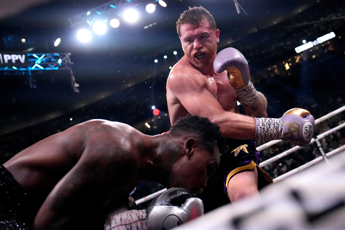 Canelo Alvarez, of Mexico, right, fights Jermell Charlo in a super middleweight title boxing match, Saturday, Sept. 30, 2023, in Las Vegas. (AP Photo/John Locher)