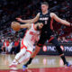 Houston Rockets guard Fred VanVleet, left, drives under Miami Heat forward Nikola Jovic, right, during the second half of a preseason NBA basketball game Friday, Oct. 20, 2023, in Houston. (AP Photo/Michael Wyke)