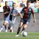 Genoa's Albert Gudmundsson, right, controls the ball from Udinese's Sandi Lovric during a Serie A soccer match between Udinese and Genoa, in Udine's Friuli stadium, northern Italy, Sunday, Oct. 1, 2023.(Andrea Bressanutti/LaPresse via AP)