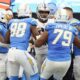 Las Vegas Raiders defensive tackle Jerry Tillery, center, is confronted by Los Angeles Chargers player after Tillery hit Chargers quarterback Justin Herbert late as Herbert ran out of bounds during the first half of an NFL football game Sunday, Oct. 1, 2023, in Inglewood, Calif. (AP Photo/Ryan Sun)