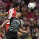 Bayern's Kim Min-jae, background, and Freiburg's Lucas Hoeler challenge for the ball during the German Bundesliga soccer match between FC Bayern Munich and SC Freiburg at the Allianz Arena stadium in Munich, Germany, Oct. 8, 2023. (AP Photo/Matthias Schrader)