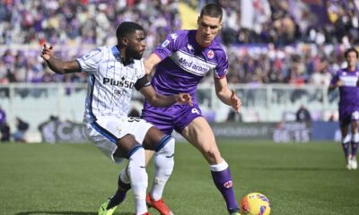 Atalanta's Jeremie Boga, left, competes for the ball with Fiorentina's Nikola Milenkovic during the Italian serie A soccer match between Fiorentina and Atalanta at Artemio Franchi stadium in Florence, Italy, Sunday, Feb. 20, 2022. (Massimo Paolone/LaPresse via AP)