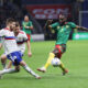 Cameroon's Moumi Ngamaleu, right, fights for the ball with Russia's Danil Glebov during an international friendly soccer match between Russia and Cameroon at VTB Arena in Moscow, Russia, Thursday, Oct. 12, 2023. (AP Photo/Alexander Safonov)