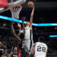 San Antonio Spurs center Victor Wembanyama (1) scores over Miami Heat center Thomas Bryant (31) during the second half of a preseason NBA basketball game in San Antonio, Friday, Oct. 13, 2023. (AP Photo/Eric Gay)