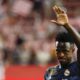 Real Madrid's Vinicius Junior greets fans at the end of the a Spanish La Liga soccer match between Girona and Real Madrid, at the Montilivi stadium in Girona, Spain, Saturday, Sept. 30, 2023. (AP Photo/Joan Monfort)