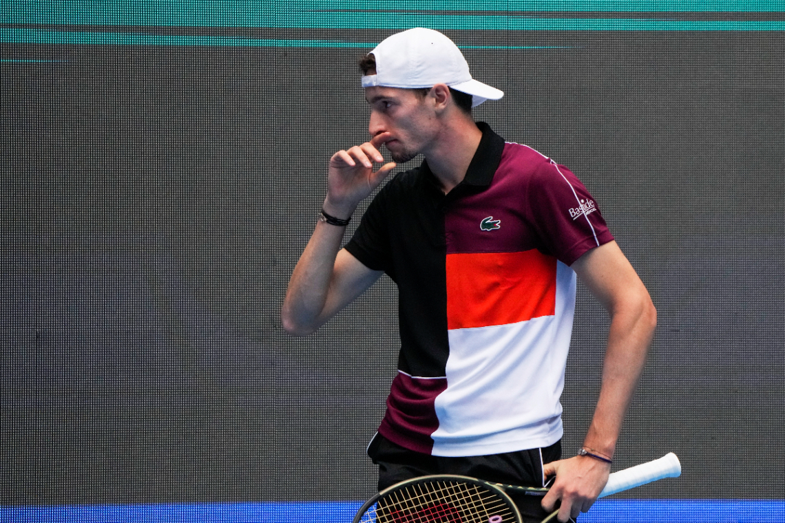 Ugo Humbert of France reacts after losing a point to Daniil Medvedev of Russia during the men's singles quarterfinal match in the China Open tennis tournament at the Diamond Court in Beijing, Monday, Oct. 2, 2023. (AP Photo/Andy Wong)