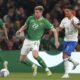 Republic of Ireland's Nathan Collins and Greece's Anastasios Bakasetas, right, battle for the ball during the Euro 2024 qualifying Group B soccer match between Ireland and Greece at the Aviva Stadium, Dublin, Friday Oct. 13, 2023. (Liam McBurney/PA via AP)