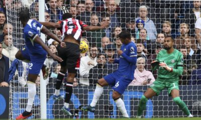 Brentford's Ethan Pinnock, second left, scores his side's opening goal during the English Premier League soccer match between Chelsea and Brentford at Stamford Bridge stadium in London, Saturday, Oct. 28, 2023. (AP Photo/Ian Walton)