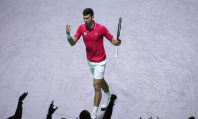 Novak Djokovic of Serbia reacts during his match against Jannik Sinner of Italy during a Davis Cup semi-final tennis match between Italy and Serbia in Malaga, Spain, Saturday, Nov. 25, 2023. (AP Photo/Manu Fernandez)