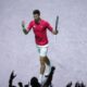 Novak Djokovic of Serbia reacts during his match against Jannik Sinner of Italy during a Davis Cup semi-final tennis match between Italy and Serbia in Malaga, Spain, Saturday, Nov. 25, 2023. (AP Photo/Manu Fernandez)