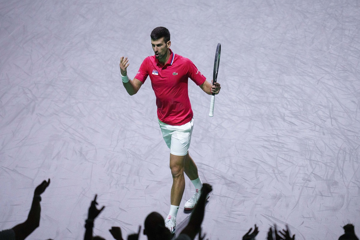 Novak Djokovic of Serbia reacts during his match against Jannik Sinner of Italy during a Davis Cup semi-final tennis match between Italy and Serbia in Malaga, Spain, Saturday, Nov. 25, 2023. (AP Photo/Manu Fernandez)