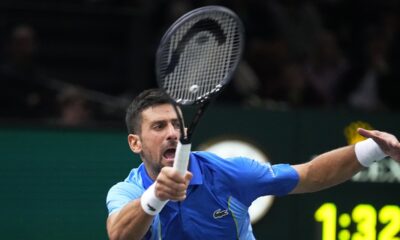 Serbia's Novak Djokovic returns the ball to Denmark's Holger Rune during their quarterfinal match of the Paris Masters tennis tournament, at the Accor Arena in Paris, Friday, Nov. 3, 2023. (AP Photo/Michel Euler)