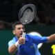 Serbia's Novak Djokovic returns the ball to Denmark's Holger Rune during their quarterfinal match of the Paris Masters tennis tournament, at the Accor Arena in Paris, Friday, Nov. 3, 2023. (AP Photo/Michel Euler)