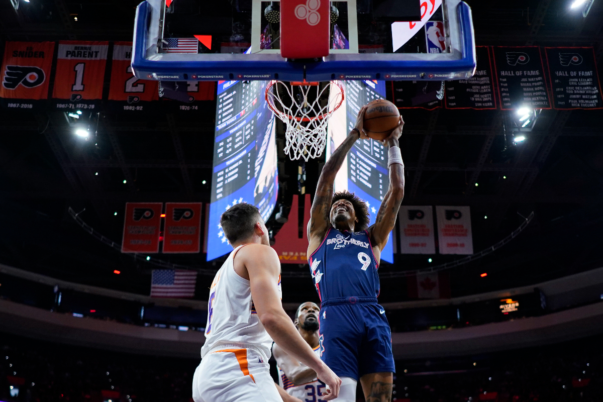Philadelphia 76ers' Kelly Oubre Jr., right, goes up for a shot against Phoenix Suns' Kevin Durant, center, and Grayson Allen during the first half of an NBA basketball game, Saturday, Nov. 4, 2023, in Philadelphia. (AP Photo/Matt Slocum)