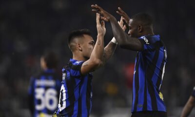 Inter's Lautaro Martinez, left, celebrates with Marcus Thuram after scoring his side's opening goal during the Italian Serie A soccer match between Juventus and Inter Milan, at the Allianz stadium in Turin, Italy, Sunday, Nov. 26, 2023. (Fabio Ferrari/LaPresse via AP)