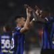 Inter's Lautaro Martinez, left, celebrates with Marcus Thuram after scoring his side's opening goal during the Italian Serie A soccer match between Juventus and Inter Milan, at the Allianz stadium in Turin, Italy, Sunday, Nov. 26, 2023. (Fabio Ferrari/LaPresse via AP)