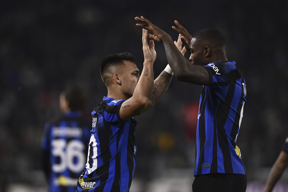 Inter's Lautaro Martinez, left, celebrates with Marcus Thuram after scoring his side's opening goal during the Italian Serie A soccer match between Juventus and Inter Milan, at the Allianz stadium in Turin, Italy, Sunday, Nov. 26, 2023. (Fabio Ferrari/LaPresse via AP)