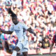 Real Madrid's Eduardo Camavinga heads the ball ahead of Barcelona's Joao Cancelo during the La Liga soccer match between Barcelona and Real Madrid at the Olympic Stadium in Barcelona, Spain, Saturday, Oct. 28, 2023. (AP Photo/Joan Monfort)