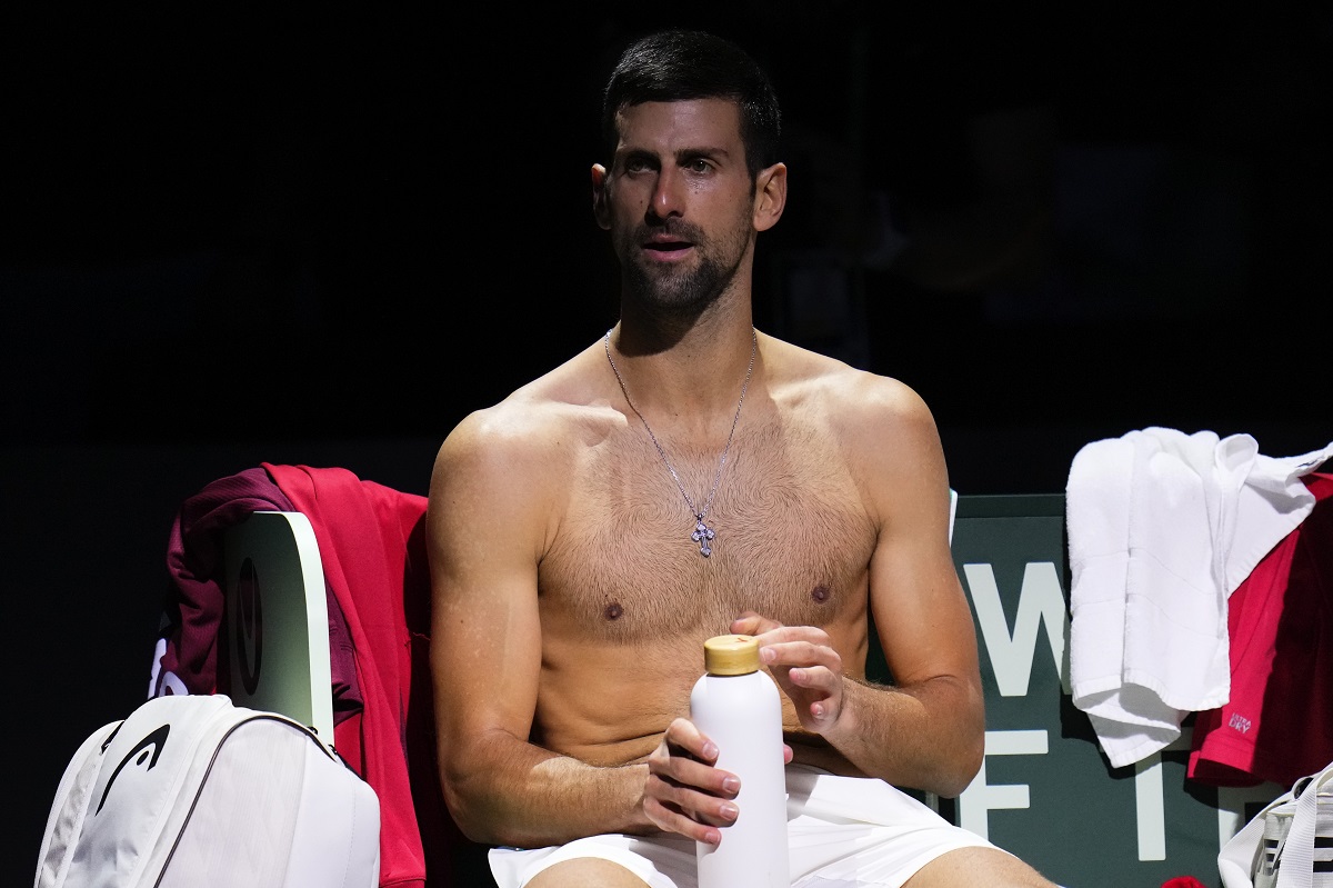 Serbia's Novak Djokovic rests on the bench during a Davis Cup quarter-final tennis match against Britain's Cameron Norrie in Malaga, Spain, Thursday, Nov. 23, 2023. (AP Photo/Manu Fernandez)