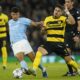 Manchester City's Matheus Nunes, left, is challenged by Young Boys' Filip Ugrinic during the group G Champions League soccer match between Manchester City and Young Boys at the Etihad Stadium in Manchester, England, Tuesday, Nov. 7, 2023. (AP Photo/Dave Thompson)