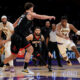 Los Angeles Lakers forward Rui Hachimura (28) drives against Houston Rockets center Alperen Sengun (28) during the second half of an NBA basketball game in Los Angeles, Sunday, Nov. 19, 2023. (AP Photo/Eric Thayer)