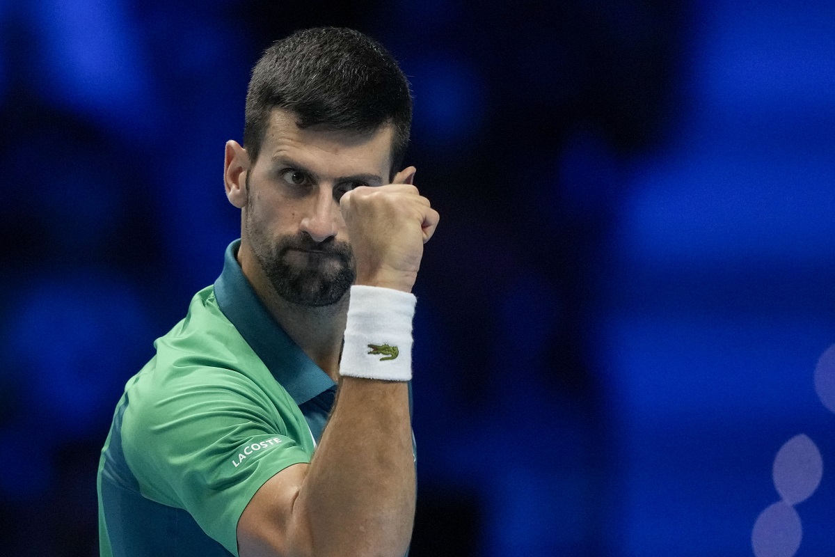 Serbia's Novak Djokovic reacts after winning a point to Italy's Jannik Sinner during their singles final tennis match of the ATP World Tour Finals at the Pala Alpitour, in Turin, Italy, Sunday, Nov. 19, 2023. (AP Photo/Antonio Calanni)