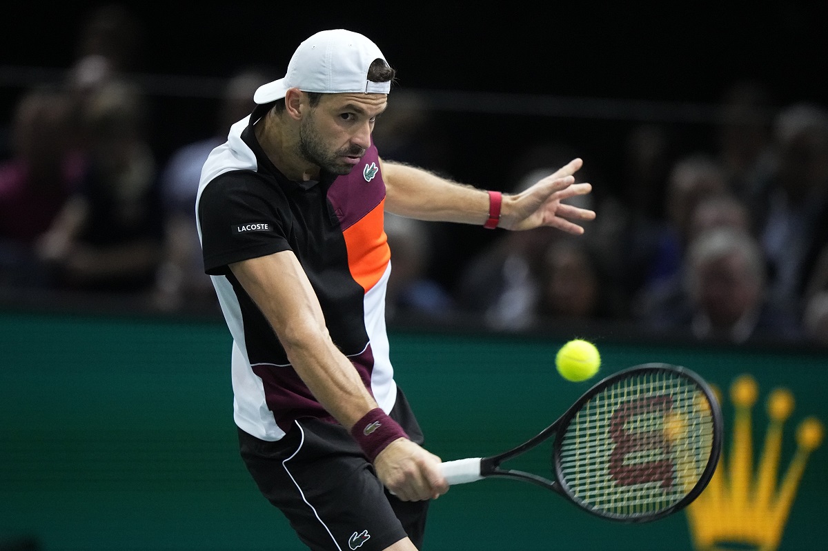 Bulgaria's Grigor Dimitrov returns the ball to Serbia's Novak Djokovic during the final match of the Paris Masters tennis tournament at the Accor Arena, in Paris, Sunday, Nov. 5, 2023. (AP Photo/Michel Euler)