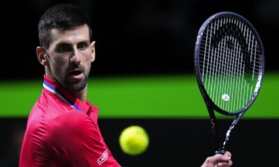 Serbia's Novak Djokovic eyes the ball as he plays a shot against Britain's Cameron Norrie during a Davis Cup quarter-final tennis match between Serbia and United Kingdom in Malaga, Spain, Thursday, Nov. 23, 2023. (AP Photo/Manu Fernandez)