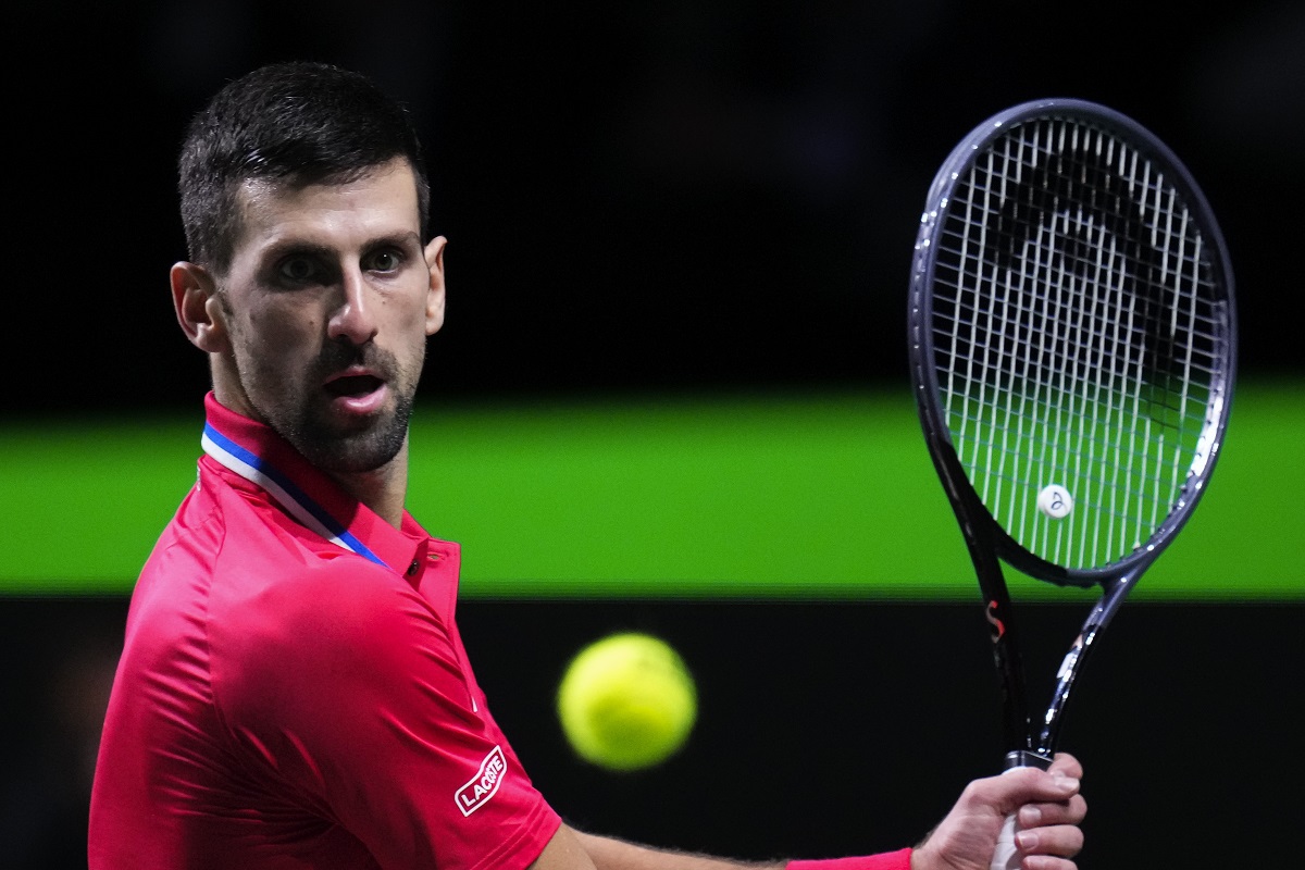 Serbia's Novak Djokovic eyes the ball as he plays a shot against Britain's Cameron Norrie during a Davis Cup quarter-final tennis match between Serbia and United Kingdom in Malaga, Spain, Thursday, Nov. 23, 2023. (AP Photo/Manu Fernandez)