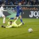 Mainz's Marco Richter, left, scores the opening goal during the German Bundesliga soccer match between TSG 1899 Hoffenheim and 1. FSV Mainz 05 in Sinsheim, Germany, Sunday, Nov. 26, 2023. (Uwe Anspach/dpa via AP)
