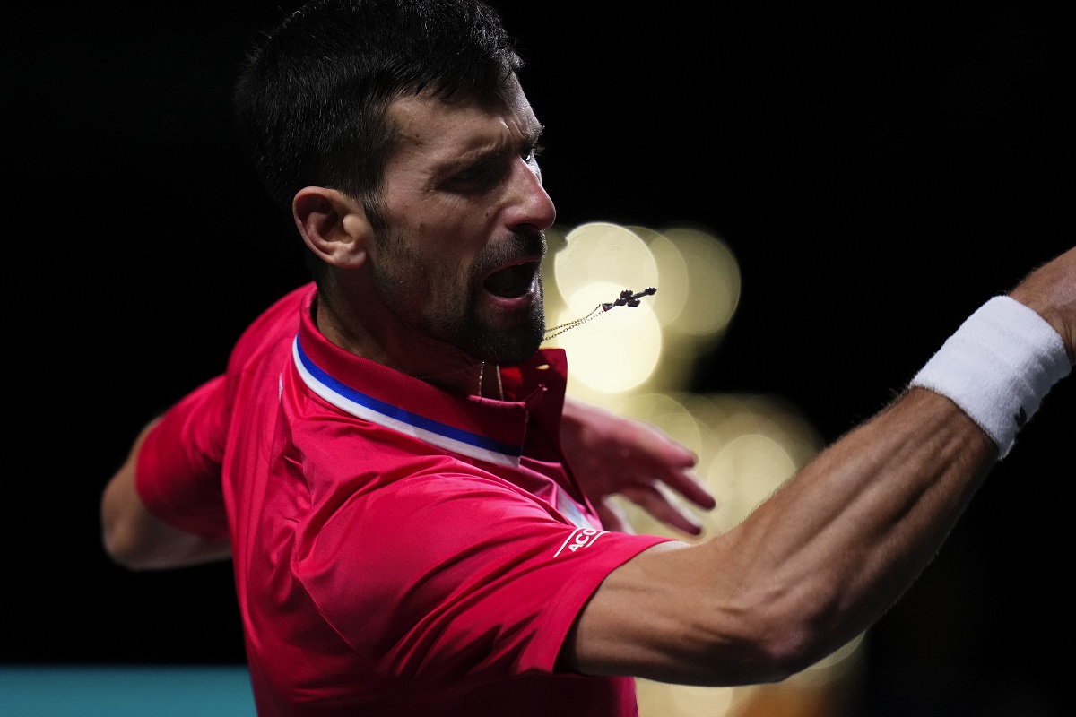 Serbia's Novak Djokovic plays a shot against Britain's Cameron Norrie during a Davis Cup quarter-final tennis match between Serbia and United Kingdom in Malaga, Spain, Thursday, Nov. 23, 2023. (AP Photo/Manu Fernandez)