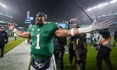 Philadelphia Eagles quarterback Jalen Hurts celebrates after scoring the game winning touchdown against the Buffalo Bills during overtime in an NFL football game Sunday, Nov. 26, 2023, in Philadelphia. (AP Photo/Matt Slocum)